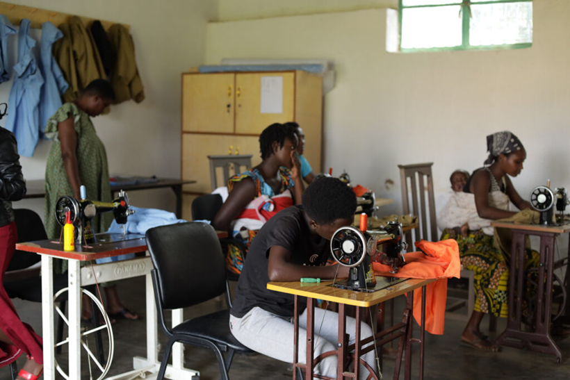 street-youth-reintegration-hairdressing-training.jpg Former street youth African females practicing sewing.